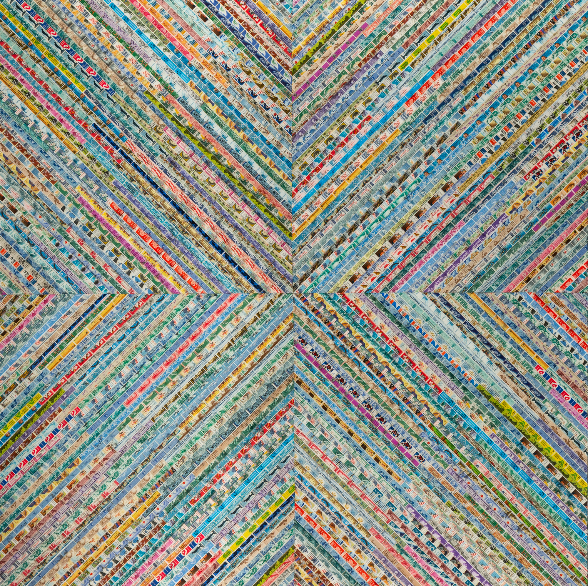 Photo of a mixed-media art piece. Rows of old postage stamps are arranged in 4 squares turned 45 degrees toward one another, so the overall piece resembles a giant x shape, or a square cross shape turned at an angle. The rows of postage stamps are sorted by color. Bright rows of red, yellow, green and other hues dominate the patterns' color scheme.