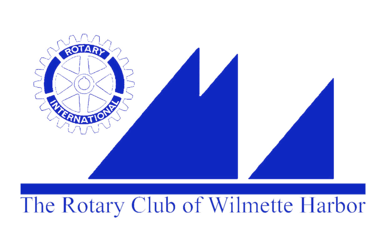 A graphic logo in blue and white. The official Rotary Club International logo, resembling a circular mechanical gear, is in the upper-left corner. Next to it are a group of right triangles with the right angle corner turned down and right so that the triangles together resemble a group of sailboats on a water surface. Below the triangle/sailboat image is the group's official name, The Rotary Club of Wilmette Harbor