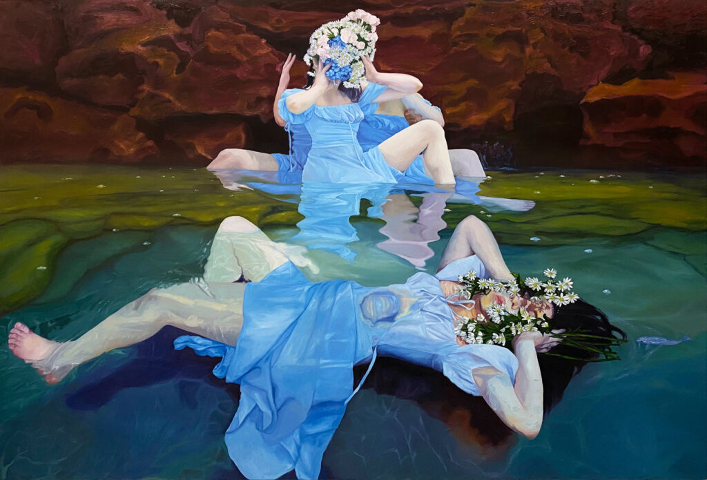 A painting of several women in light blue dresses laying and seated in a shallow pool amidst a rocky background, as though they're in a cave. The figures are all depicted as being partially submerged, thereby distorting their image to almost surreal effect. Their faces are covered with flowers.